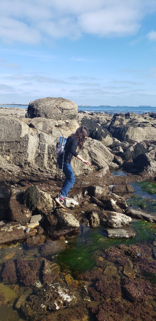 child balancing on large rocks